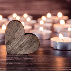 Leor and Lair tea lights on a dining centerpiece create intimate ambience.