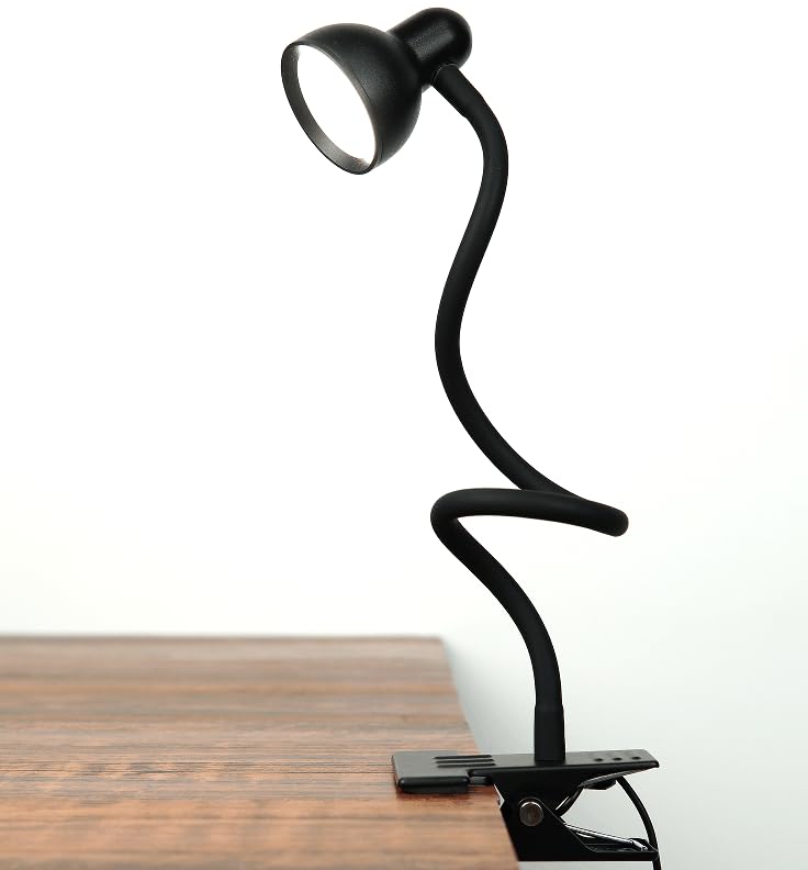 LiFMIRA clip-on reading light clipped to a bedside rail for convenient reading.