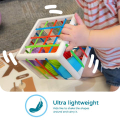 Little one fits shapes into matching holes to boost hand-eye coordination.