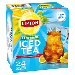 Amber-colored Lipton iced tea poured into a glass with condensation.