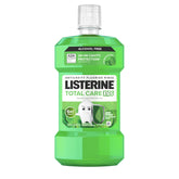 Listerine Total Care Kids Mouthwash bottle-pour shows Mint Shield flavor and ongoing cavity protection potential.