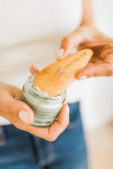 Compact, reusable deodorant scoop reducing waste and mess.