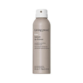 Living Proof No Frizz Instant De-Frizzer bottle close-up showing a conditioning spray that tames frizz
