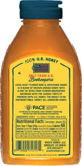 Local Hive Florida honey jar closeup shows amber color and natural texture.