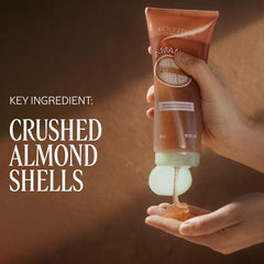 Loccitane Almond Shower Scrub tube close-up highlights packaging and design.