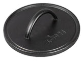 Lodge pre-seasoned round cast iron press close-up of the spiral handle for safe, comfortable grilling.