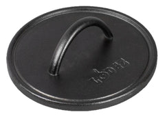 Lodge pre-seasoned round cast iron press close-up of the spiral handle for safe, comfortable grilling.