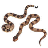 Lohoee realistic snake toy perched on a branch to deter birds.