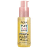 L'Oreal Paris Bond Repair+ Oil-in-Serum bottle pour smooths and protects hair while styling