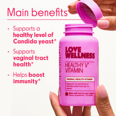 Love Wellness Healthy V Vitamin ingredients like garlic and turmeric in a spoon