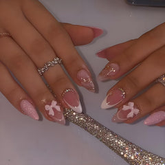 LPOODDNU almond press-on nails in medium pink with 3D bow glitter for at‑home manicure