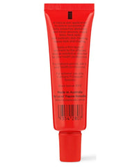 Purse-size Lucas Papaw Ointment tube in hand highlights portable lip protection.