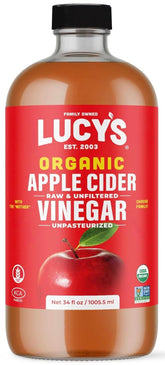 Lucy’s Apple Cider Vinegar bottle with the Mother, rich and unfiltered for dressings.