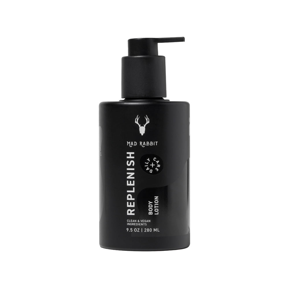 Mad Rabbit Replenish tattoo body lotion bottle on a clean surface for daily hydration