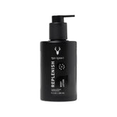 Mad Rabbit Replenish tattoo body lotion bottle on a clean surface for daily hydration