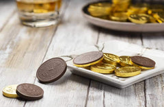 Assorted sizes of Madelaine Gold Chocolate Coins ready for baskets.