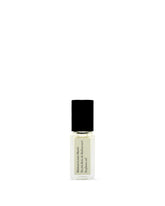 Maison Louis Marie No.04 Bois de Balincourt roll-on bottle close-up for on-the-go fragrance.