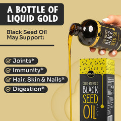 MAJU Black Seed Oil drops on a spoon for daily ritual.