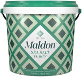 Maldon sea salt flakes tub close-up for gourmet seasoning and crisp texture.