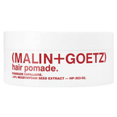 MALIN+GOETZ Hair Pomade bottle pour demonstrates easy application for textured volume.