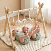 Mallify wooden baby gym frame with six hanging toys for safe exploration.