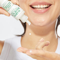 Applying Mario Badescu Deep Blemish Solution to a blemish for targeted relief.