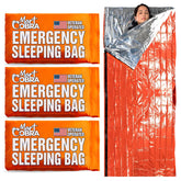 Mart Cobra emergency sleeping bag 3-pack laid out for portable warmth outdoors.