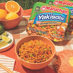 Maruchan Yakisoba Orange Chicken with cabbage and carrots garnish, colorful crunch.