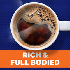 Pouring Maxwell House Dark Silk into a mug for a bold, smooth brew.