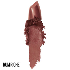 Maybelline Rum Riche cream-finish swatch on skin highlights smooth, hydrated look.