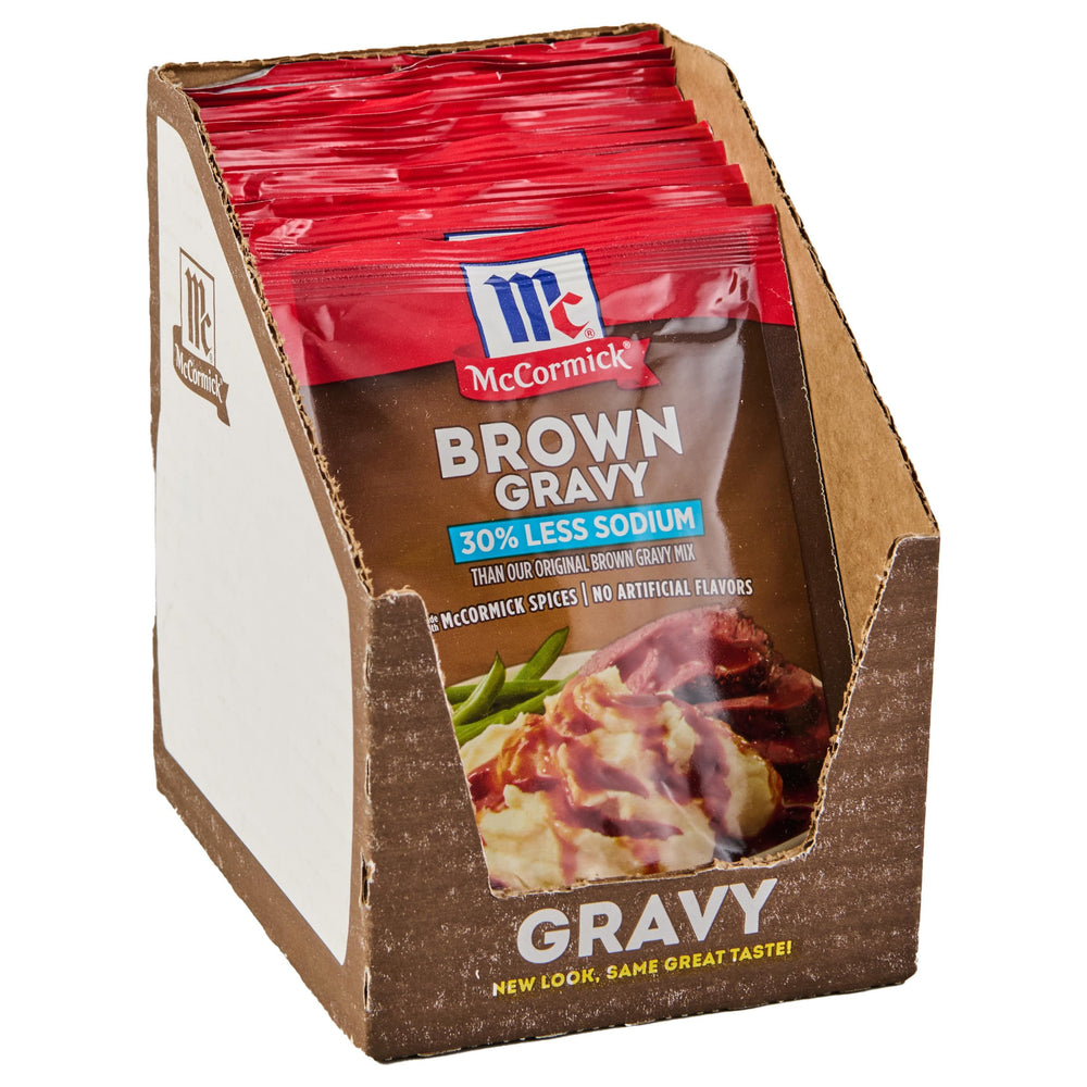 McCormick 30% Less Sodium Brown Gravy Mix packet ready to simmer for rich flavor.