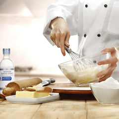 McCormick Culinary imitation almond extract in a baking setup suggesting easy integration.