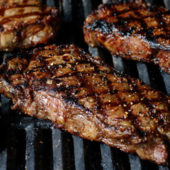 Grilling steak with Montreal Seasoning rub from McCormick Grill Mates.