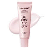 Medicube No Cast Just Glow sunscreen bottle pour shows easy dispensing for skincare-ready use
