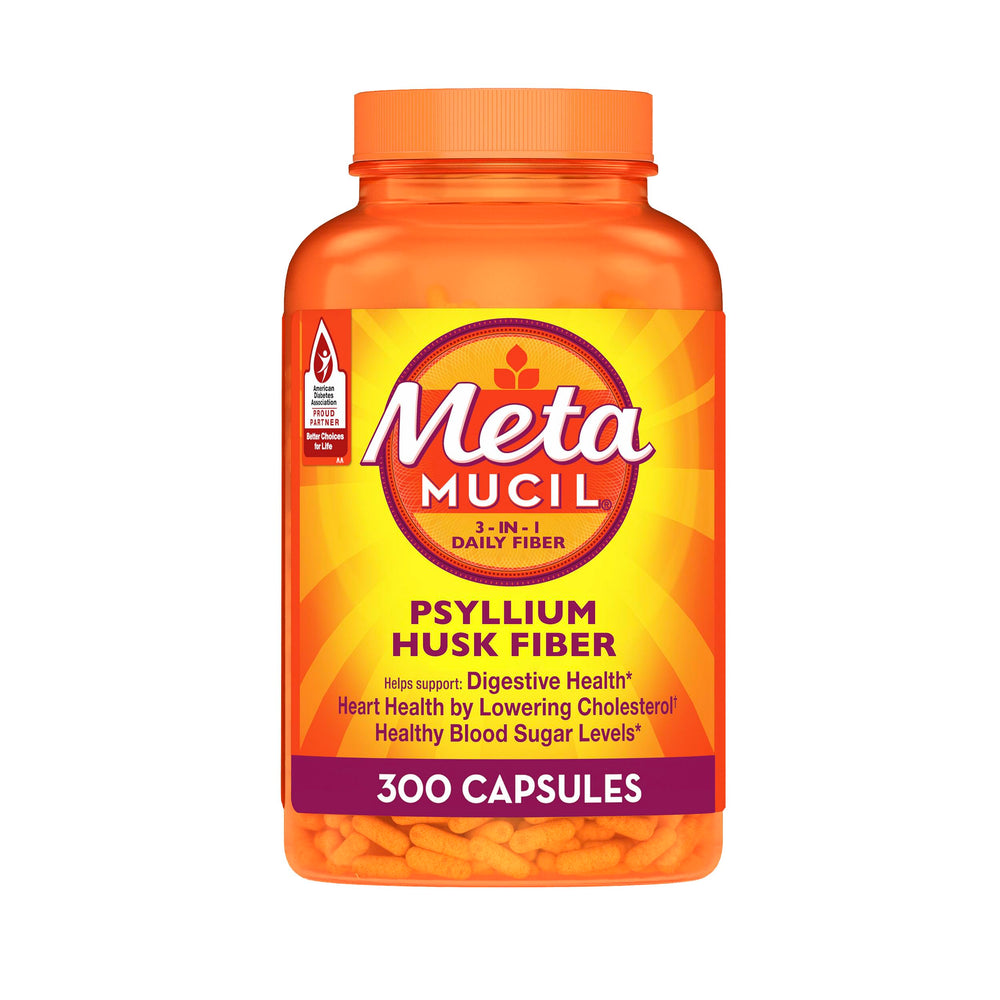 Metamucil bottle and capsules on the counter support daily fiber intake.