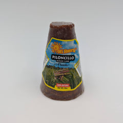 Close-up of piloncillo cone texture with rich molasses hue
