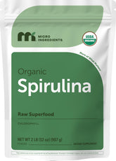 Micro Ingredients spirulina powder bottle shows vibrant green color for vegan protein boost.