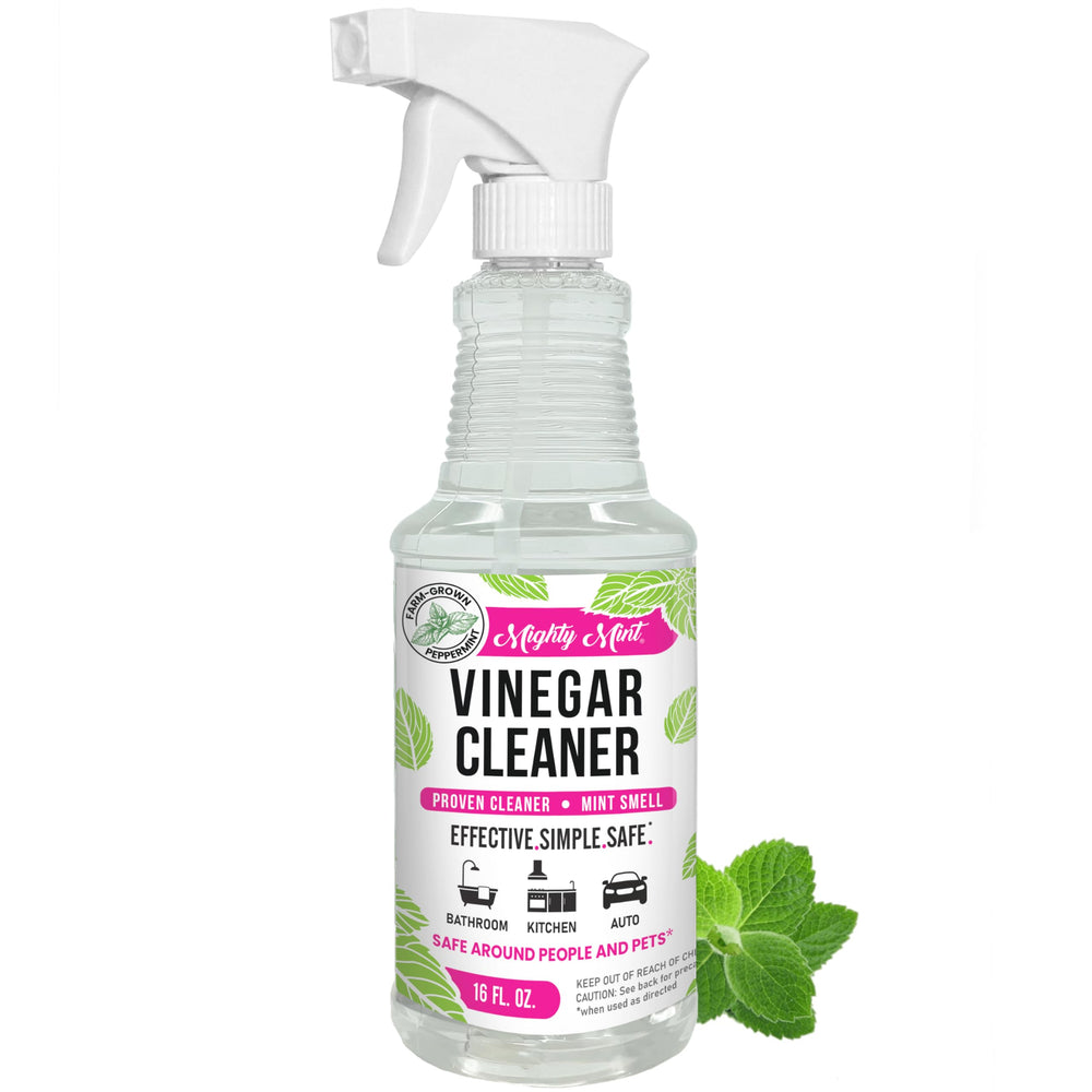 Mighty Mint Vinegar Cleaner bottle demonstrates minty spray for quick kitchen grime removal.