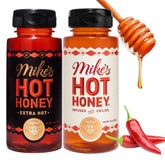 Mike's Hot Honey Original bottle pours on pizza for sweet heat