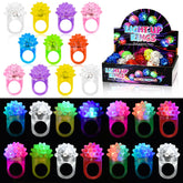 MINGOMINGO glow rings in pink and blue illuminate kids' outfits at parties.