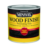 Minwax True Black stain bottle pour showing rich interior color potential