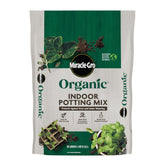 Miracle-Gro Organic Indoor Potting Mix texture close-up showing coir and peat blend.