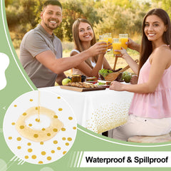 Misaya white rectangle tablecloth with gold dots enhances party tables at events.