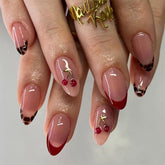 Mivota almond nails with 3D cherry design and gold branches for chic at-home manicure