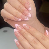 Modelones pink French tip almond press-on nails displayed for at-home styling