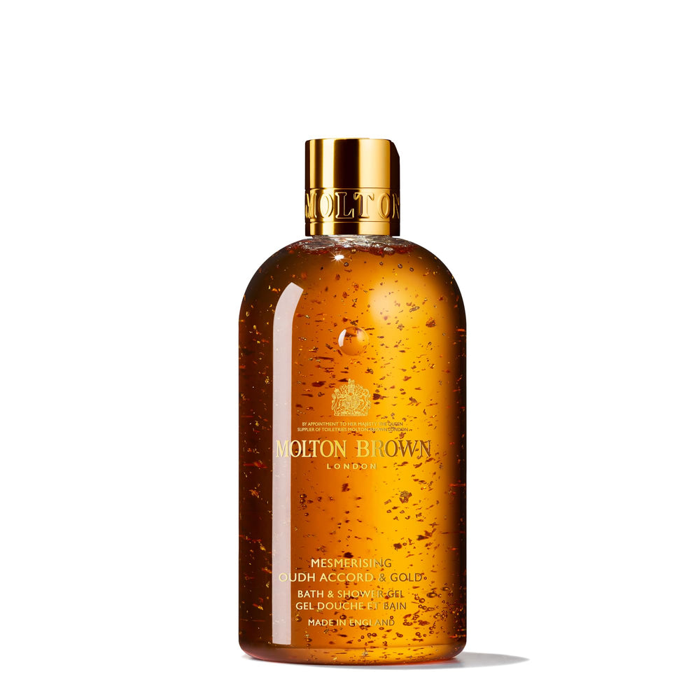 Molton Brown Mesmerising Oudh Accord & Gold bottle with real gold flakes for a luxe shower ritual.
