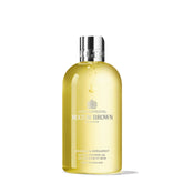 Molton Brown Orange & Bergamot body wash bottle with uplifting citrus aroma.