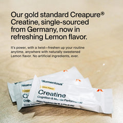 Momentous Creatine Lemon Powder dissolving in glass demonstrating solubility