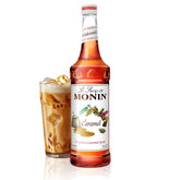 Monin Caramel Syrup bottle ready to pour for coffee and desserts.