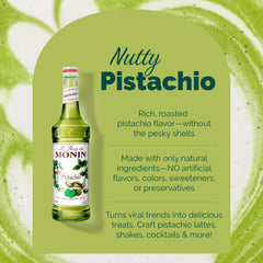 Monin Pistachio Syrup beside a latte with nutty flavor